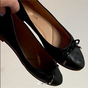 Black faux leather flats